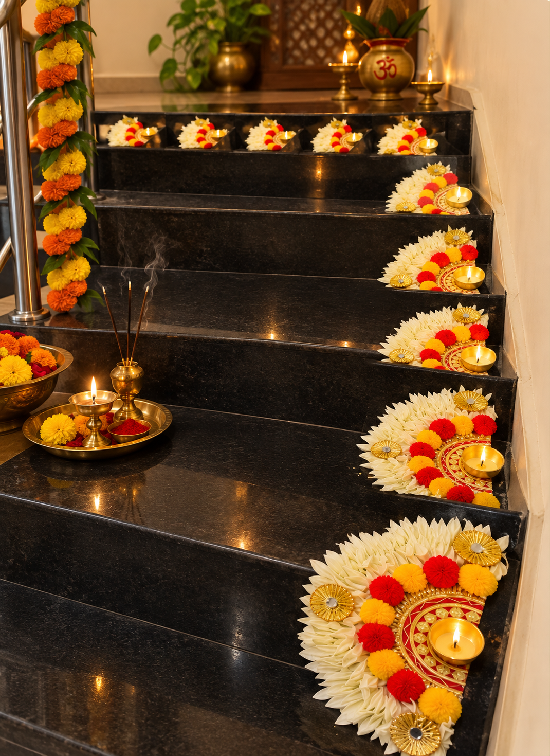 Shankh Phool white half-moon pom pom mats on dark staircase risers – white on dark contrast for Navratri and wedding décor | Craft Decor