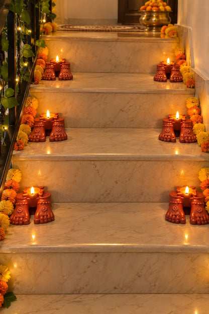 Jal Jyoti Lakshmi Charan sacred footprint diyas glowing on Diwali staircase steps – Set of 12 | Craft Decor